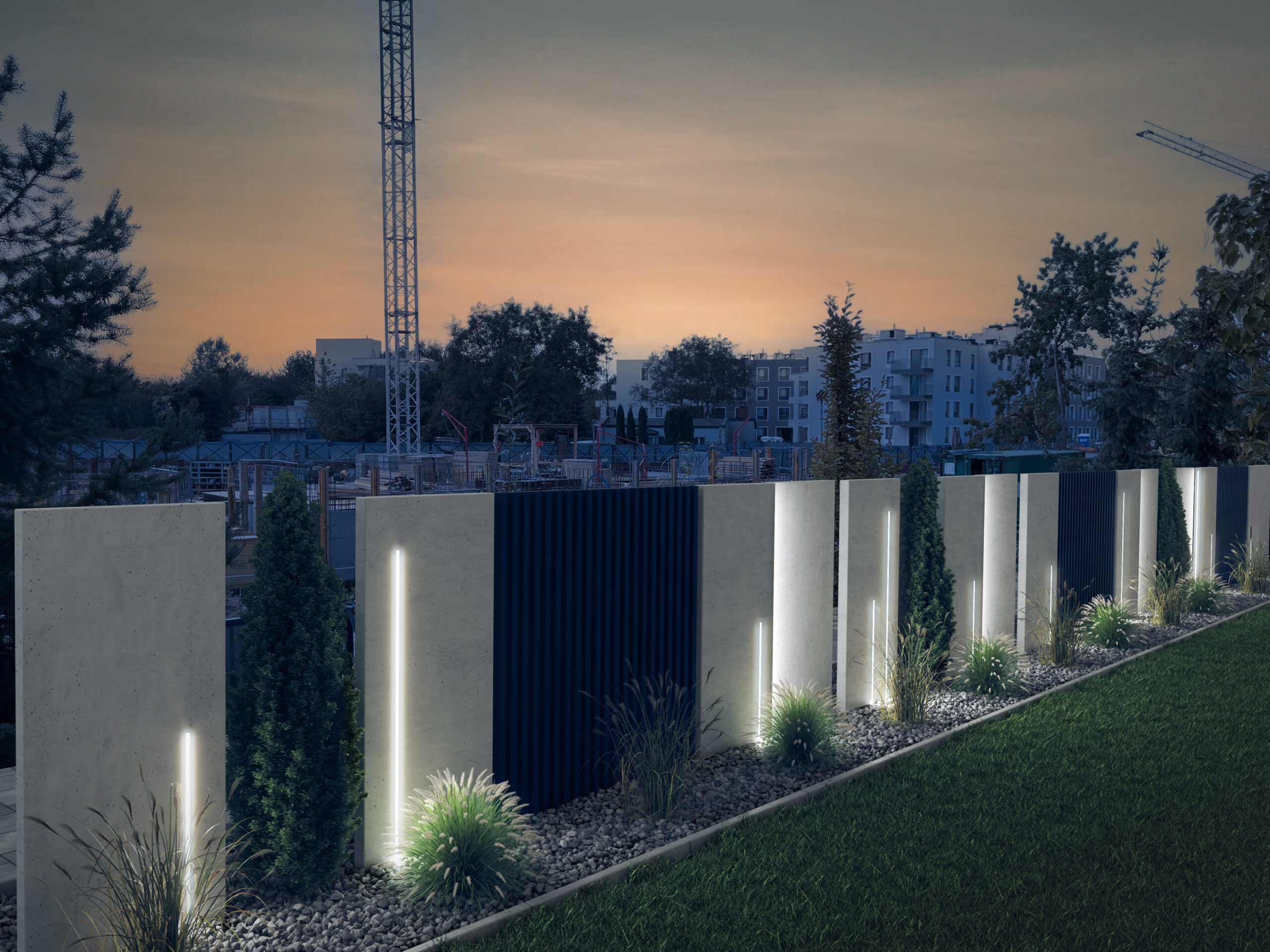 Podświetlone ogrodzenie betonowe, w tle znajduje się widok na miasto