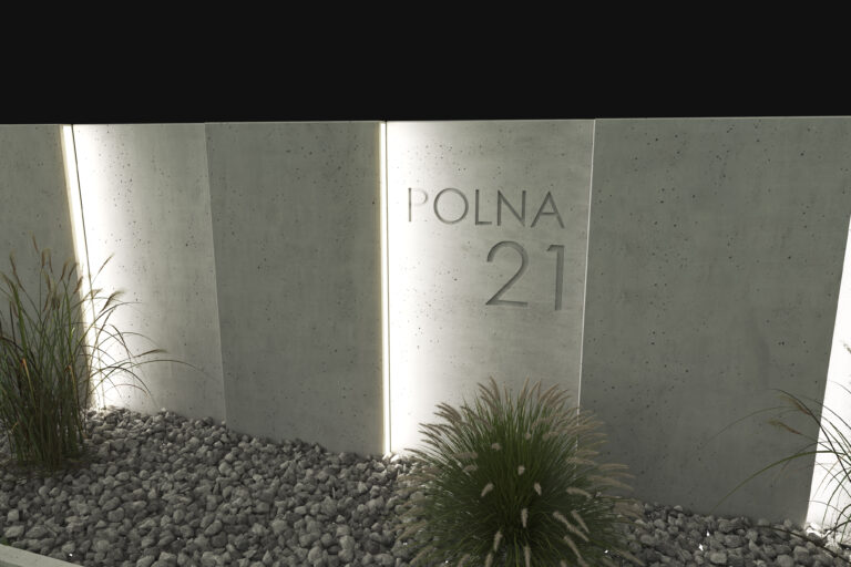 Widok na podświetlone ogrodzenie betonowe